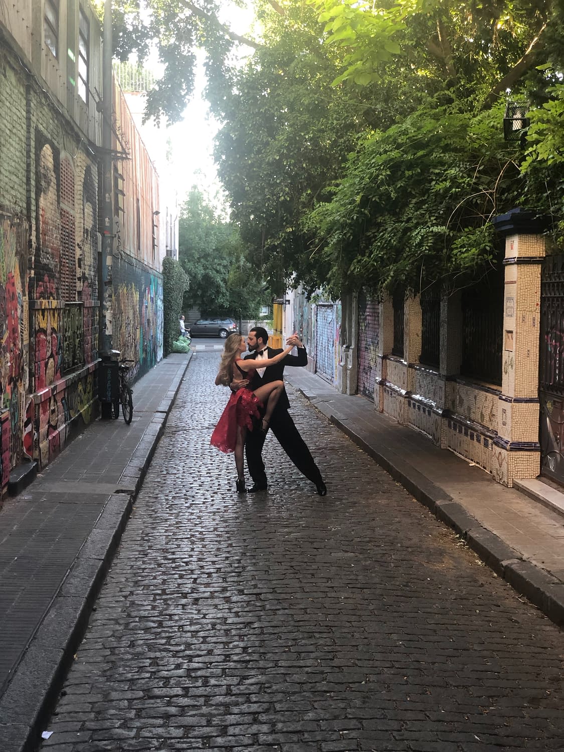 man and woman dancing tango in the street