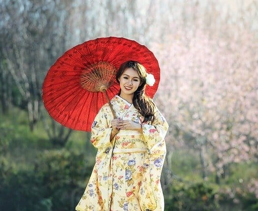 woman in japanese dress with a red umbrella