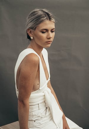young woman dressed in a white dress with grey hair