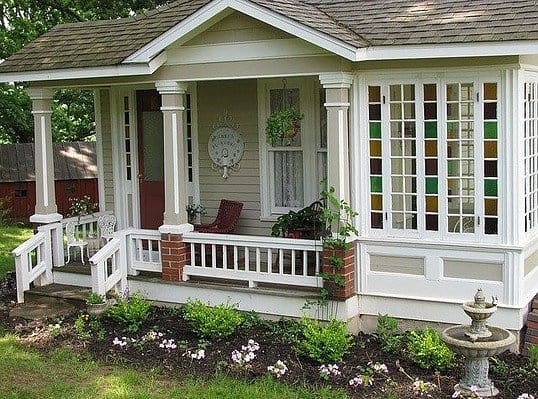 white tiny house with veranda