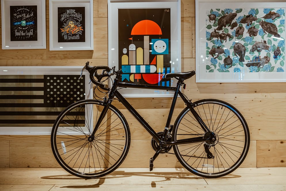 a black bicycle in front of a house
