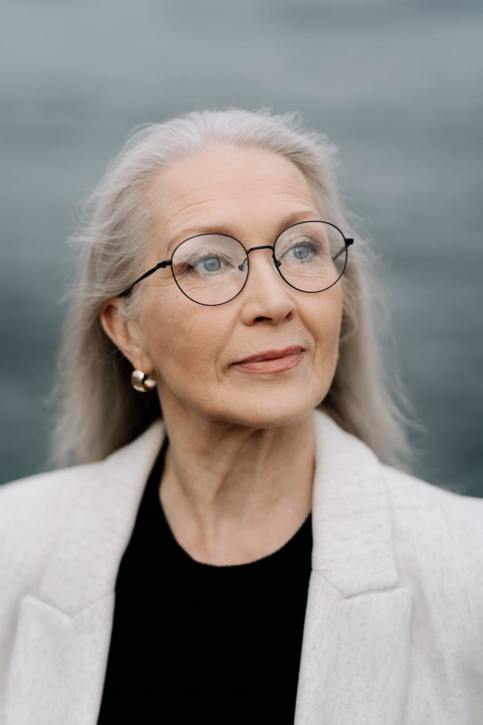 older woman, grey hair with glasses