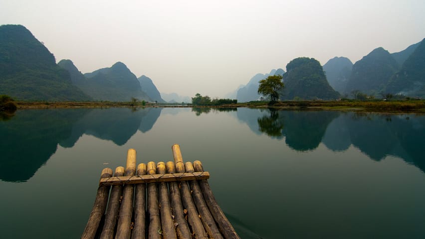 a peaceful scenery, with a calm water, forest and a lake, zen atmosphere