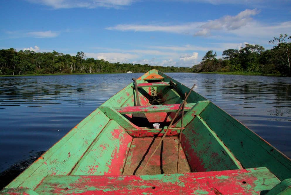 a boat floating over the Amazon river