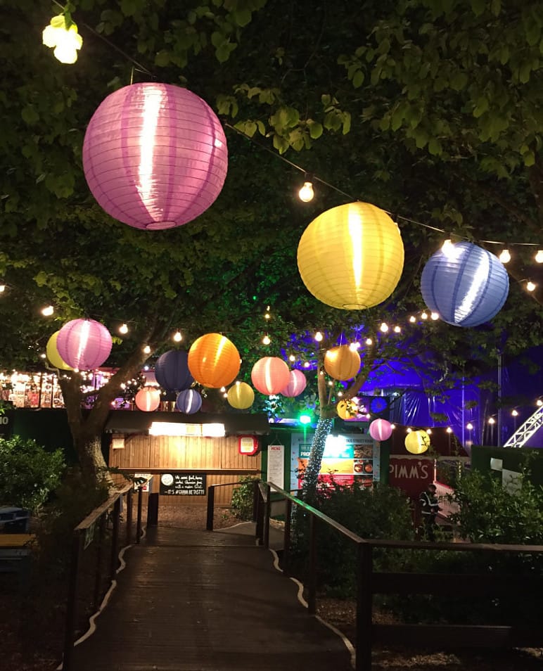 Hanging ball lamps in a garden at night